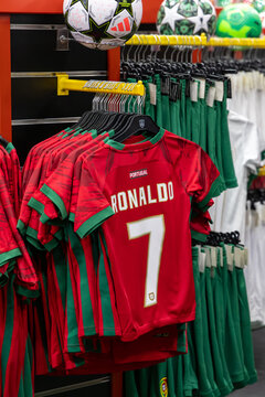 Funchal, Portugal - November 11, 2025: Portugal national football team jersey featuring Cristiano Ronaldo number 7 displayed in a sports merchandise store with soccer balls in the background