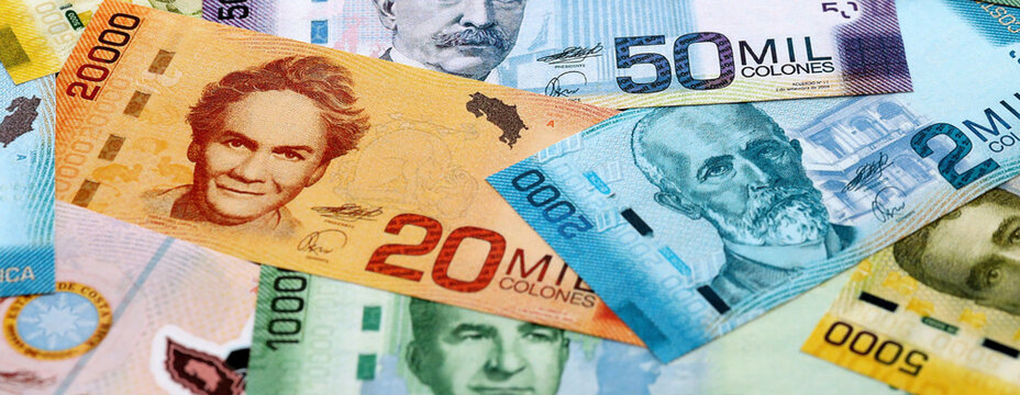 Costa Rican old colon money banknotes pile on table. Costa Rica bills of CRC currency close up