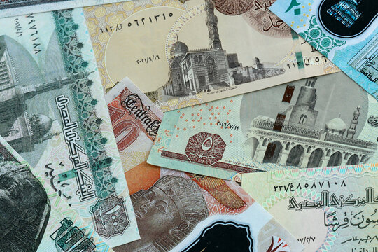 Egyptian pound money banknotes pile on table. Egypt bills of EGP currency. Concept of economy