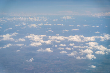 Obraz premium Blue Sky with White Clouds, Flying above Sunny Cloudy Sky Texture Pattern, Fluffy Clouds Plane View
