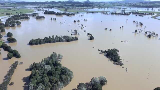Wide aerial of flooded farmland and river system near Whangarei Northland New Zealand after storm
