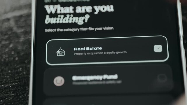 Screen titled What are you building, user selects the Real Estate investment category
