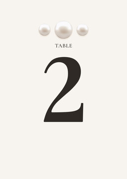 Elegant wedding table number 2 card with pearl decoration and refined typography on soft neutral background. Ideal for reception seating arrangement and table organization.