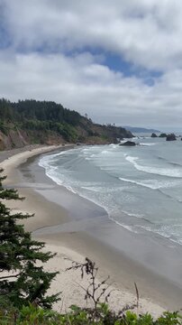 tide gently rolling out on Secret Beach in Oregon a secluded cove within the Samuel H. Boardman State Scenic Corridor near Brookings