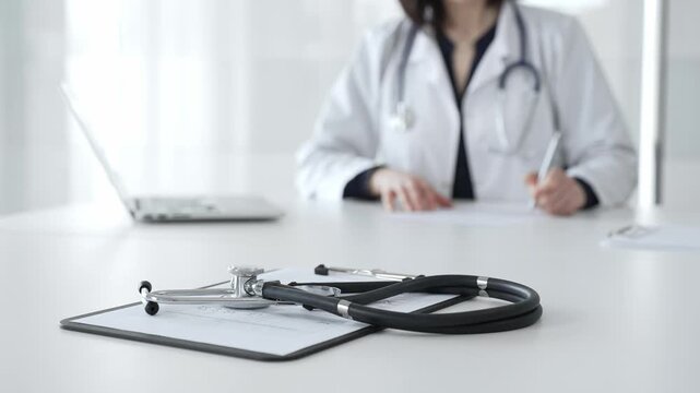Stethoscope on clipboard, doctor working in office, preparing for patient examination, medical healthcare appointment. Medicine, healthcare and science concept