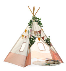 Stylish wigwam for child's room with leaves, books and pillow isolated on white © New Africa