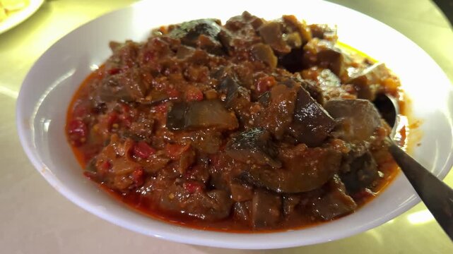 Zacusca - Romanian food. Slices of bread with vegetable spread, roasted eggplant, onions, tomato paste and roasted red peppers. Autumn and vegetarian food.