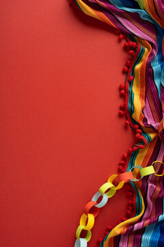 Colorful Cinco de Mayo fiesta vertical background with Mexican serape and paper chain decoration