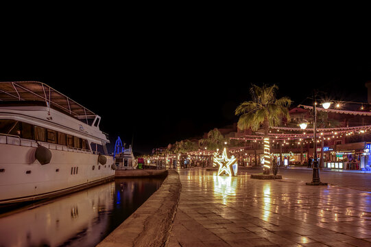 Luxury Yacht and Festive Star Decorations at Hurghada Marina Night Promenade