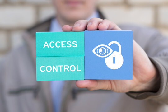 Business person holding blocks with icon lock and eye sees the text ACCESS CONTROL. Concept of access control. Cybersecurity and data protection. Automatic access control system.