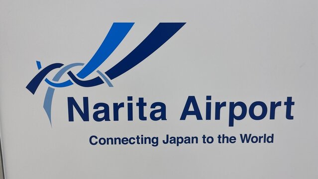 Narita Airport corporate logo and slogan Connecting Japan to the World at international passenger terminal wall signage - Chiba, Japan, October 29, 2025