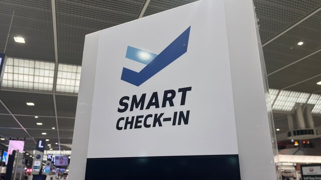 Smart Check-in signage featuring infotouch technology digital kiosk branding for streamlined passenger processing at Narita Airport - Chiba, Japan, October 29, 2025