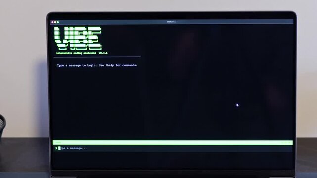 Middle Aged Man Turns Hacker in Hoodie After Using Vibe Coding Command Line Interface Artificial Intelligence Large Language Model Assistant Concept