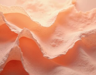 Fototapeta premium Close up abstract view of crumpled textured paper in soft peach hues. Light plays across wrinkled folds and rough edges, creating depth. Blank surface for creative use.