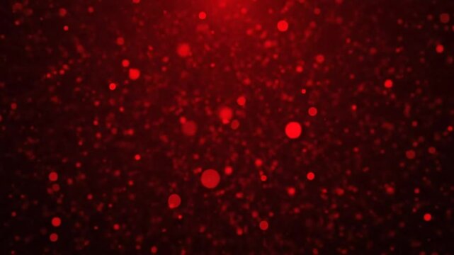 Abstract red glitter particles background with blurred bokeh lights creating a magical and festive atmosphere