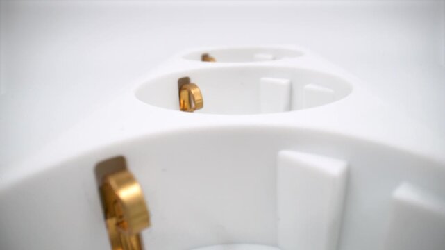 Close up of triple plug socket isolated on white background