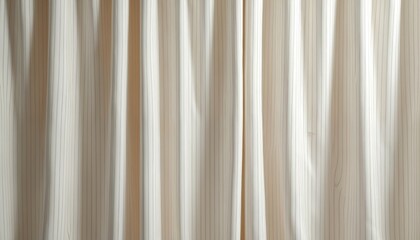 Obraz premium Gentle neutral fabric drapes with subtle vertical pinstripes. Soft folds create depth and shadow play. Ideal backdrop for minimalist design and modern interiors.