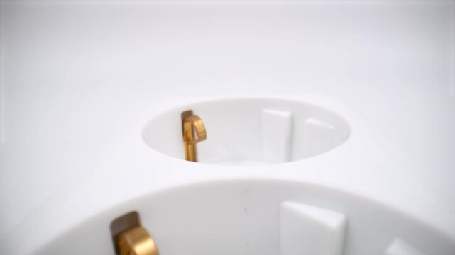 Close up of triple plug socket isolated on white background