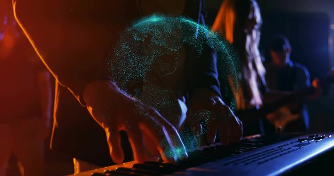 Male keys player playing music session striking keys making teal orb pulsing on hands camera moving