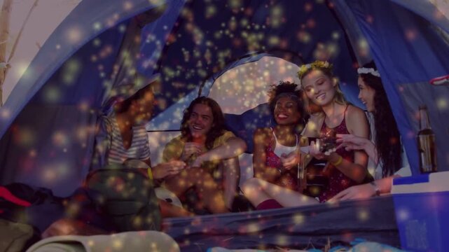 Woman picking up uke strumming camping friends leaning sharing song as sparkles densifying faces