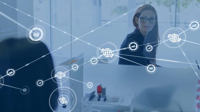 Woman turning, smiling while globe icon appearing above divider sparking business network over desk