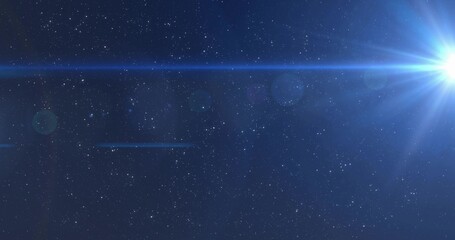 Fototapeta premium Emitting bright blue star sending radial beams across outer space, lens artifacts, copy space