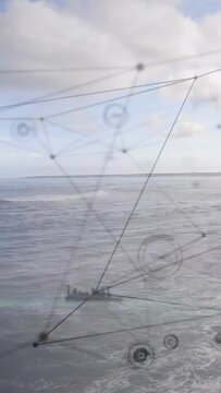 Vertical video: Camera panning over sea, HUD overlay shifting nodes and bars for marine tech