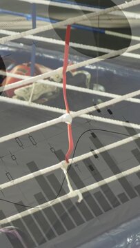Vertical video: Camera pulling back showing red wire on rope grid, blue rails, overlays mapping gym