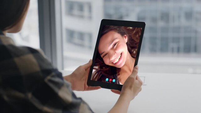 Best friends chatting video tab at apartment closeup. Teenagers chat web camera