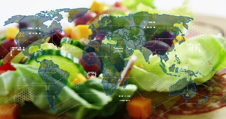 Displaying colorful salad plate with lettuce, cucumber, olives on wooden table, world map overlay © vectorfusionart
