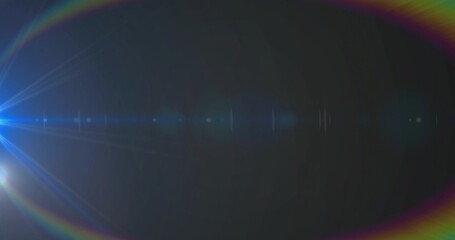Fototapeta premium Showing blue-white flare at left on black field, with radial spikes and lens ghosts, copy space