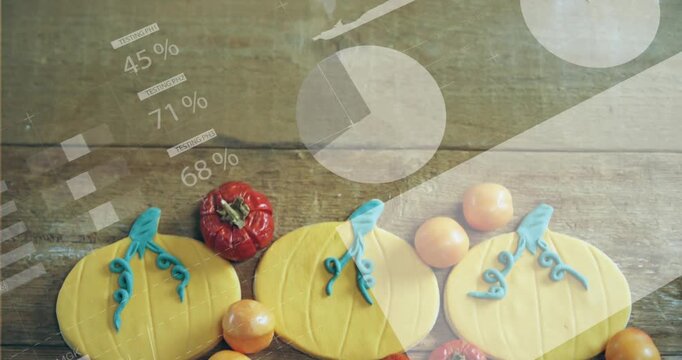 Animated pie charts arriving, sliding over three iced cookies on wood plank for food branding