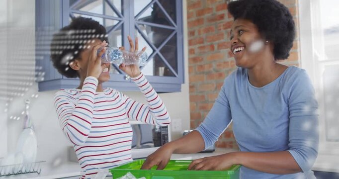 Teenager drinking and using bottles, encouraging mother sorting recycling bin, overlay showing map