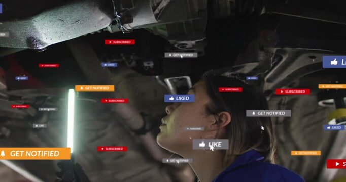 Female tech checking car underside with LED, cursor hovering causing LIKE badges appearing, fading