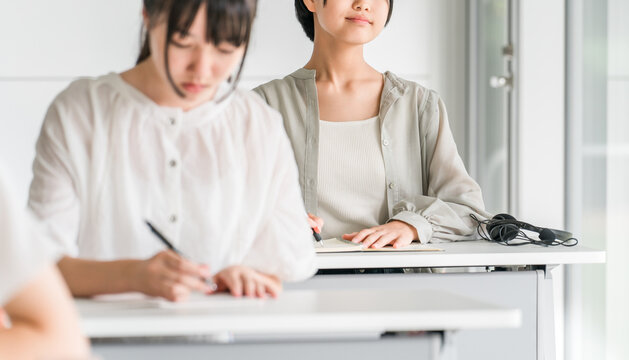 Elementary, middle, and high school girls in casual clothes attending classes at school or cram school.