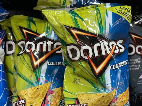 Doritos collision tortilla chips displayed on retail shelf in grocery store snack aisle. March 18 2026, Gleichen, Alberta, Canada. For editorial use only.