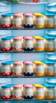Refrigerator shelf with yogurt jars in row