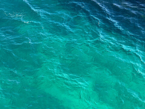Sea water clear blue rippled surface.