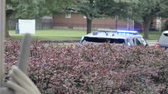 Police lights flashing in background with someone pulled over 4k