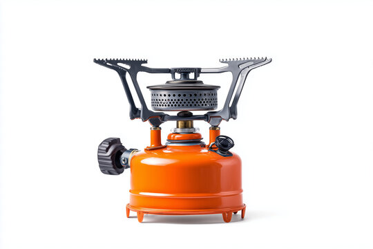 Portable gas camping stove with metal burner and orange fuel tank outdoor cooking equipment isolated on white background
