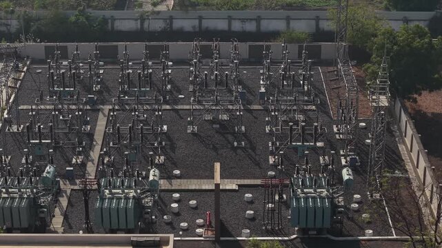 Overhead Perspective of Electrical Substation Layout with Transformers and Busbar Systems.
