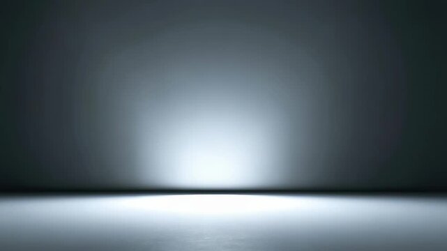Minimalist empty room with smooth concrete floor and illuminated wall, creating a modern futuristic atmosphere. Soft spotlight casts gentle gradient shadows across the seamless background