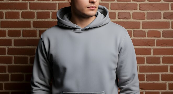 Portrait of young man in sweater at brick wall mock up for design hoodie mockup clothing design fashion casual hoodie isolated blank apparel cotton template