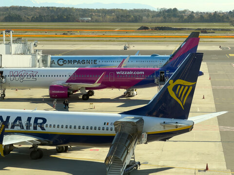 Ryanair, Wizzair and La compagnie airplanes at the gate of MXP Milano Malpensa international airport