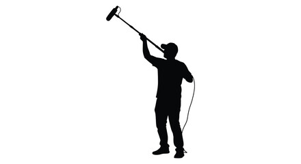 Sound recordist holding boom mic captured in a dramatic silhouette © AL-AMIN