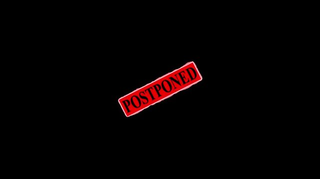 postponed stump seal on black background,, red positioned stamp text animation on black background 4k motion footage