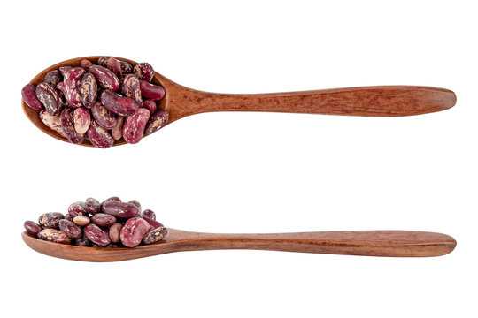 beans in a wooden spoon isolated on white background