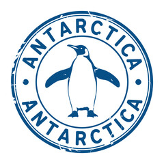 Antarctica stamp featuring a penguin illustration within a circular border © MDMOGGEM