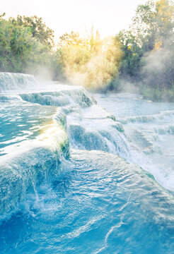 Pure Mineral Thermal Water Cascades at Sunrise, Natural Spa Background for Beauty and Skincare
