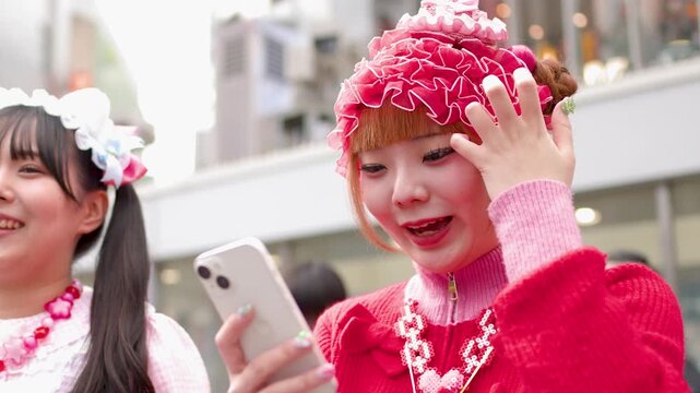Japanese Decora Fashion Girls Taking Selfies on Harajuku Street in Tokyo